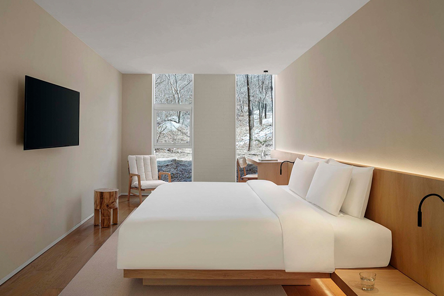 Minimalist hotel furniture collection, featuring sleek designs for guest room spaces. Perfect for modern, understated luxury hospitality interiors.